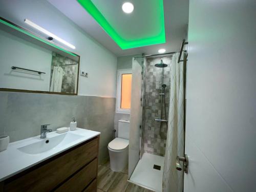 a bathroom with a sink and a shower with a toilet at Colorado Golf by Infinity Summer in Maspalomas