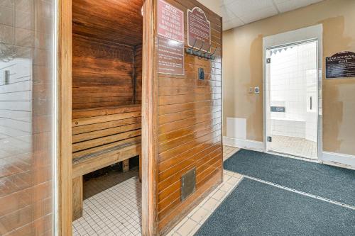 a sauna in a building with a wooden wall at Steps to Sand Myrtle Beach Gem with Oceanfront Pool in Myrtle Beach