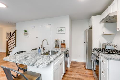 a kitchen with a sink and a counter top at Walkable Dtwn Townhome Near Campus and Palmer Square in Princeton
