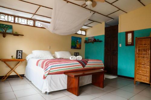 a bedroom with a bed with two towels on it at Casa Marimba in La Laguna