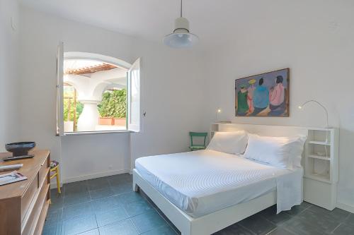 Giường trong phòng chung tại Villa Di Charme Ischia Porto