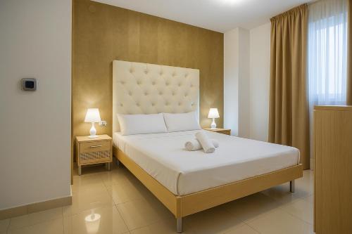 En eller flere senge i et værelse på Holiday World Magic El Cano