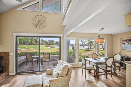 a living room with a couch and a table at Dataw Island 2004 Bluff Villa in Ashdale