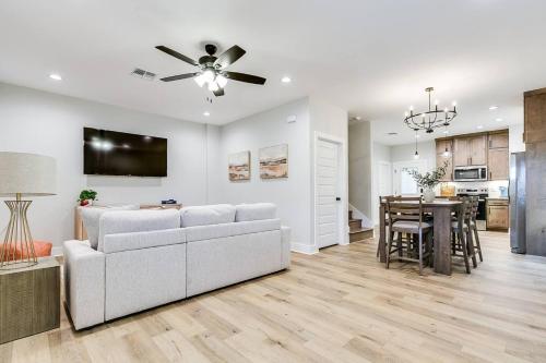 a living room with a white couch and a table at The Inn at Holiday 3BR 2 and a half BA in San Angelo