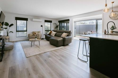 a kitchen and living room with a couch and a table at Pepik in Hawley Beach in Hawley Beach