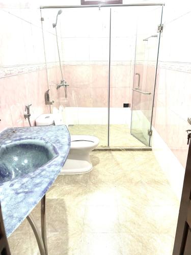 a bathroom with a sink and a toilet at Cali homestay in Phú Vang