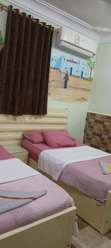 Postel nebo postele na pokoji v ubytování Awi Guest House
