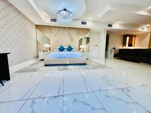 a bedroom with a bed on a marble floor at H & H Boutique & SPA in Roodepoort