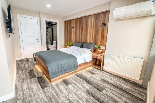 a bedroom with a bed and a television in it at Piola Hotel Kadıköy in Istanbul