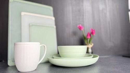two white cups and saucers on a counter with flowers at 2 domes in Glendale Utah Fantastic Stargazing in Glendale