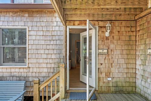 a door leading to a porch on a house at Courtyard Villas On Silver Lake in Ocracoke