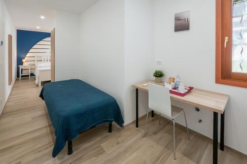 Una cama o camas en una habitación de Affittacamere LA SCALA