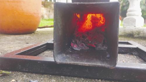 a fire in a container on a table at Quinta Divina Providencia in Fusagasuga