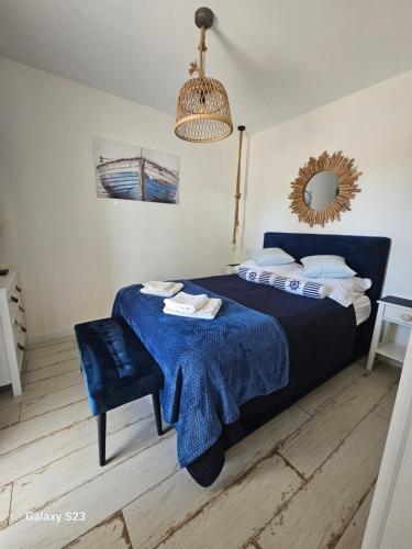 Postel nebo postele na pokoji v ubytování Apartament Powstańców A23 z dostępem do basenu BALTIC APARTAMENT