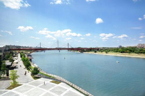a view of a river with a bridge at The St. Regis Belgrade in Belgrade