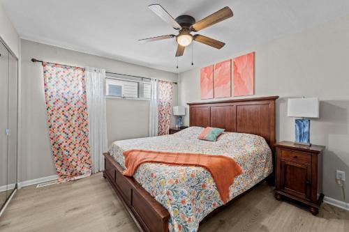 a bedroom with a bed and a ceiling fan at N3709- Game Changer in Nags Head