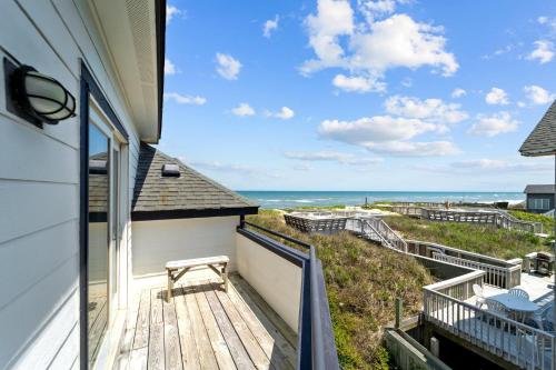 a balcony with a view of the ocean at N3709- Game Changer in Nags Head