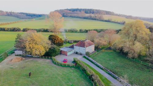 an aerial view of a house in a field at Charlton End - Goodwood Events in Chichester