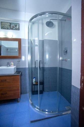 a bathroom with a shower and a sink at Amazing Home in Kathmandu in Pātan