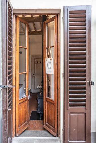 an open door to a room with a door at Le Terrazze Del Chianti b&b Residenza d'Epoca e di Charme in Tavarnelle in Val di Pesa