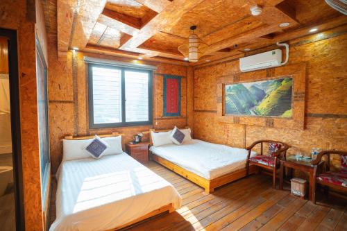 Ένα ή περισσότερα κρεβάτια σε δωμάτιο στο Sinai Bungalow & Hotel SaPa