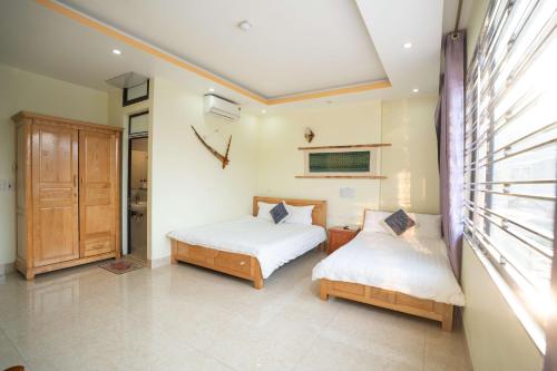 Ένα ή περισσότερα κρεβάτια σε δωμάτιο στο Sinai Bungalow & Hotel SaPa