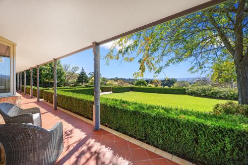 an exterior view of a garden from a patio at Hubbard Hill in Yarra Glen
