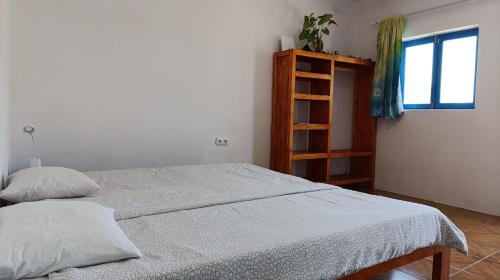 Postel nebo postele na pokoji v ubytování Oiá Paúl