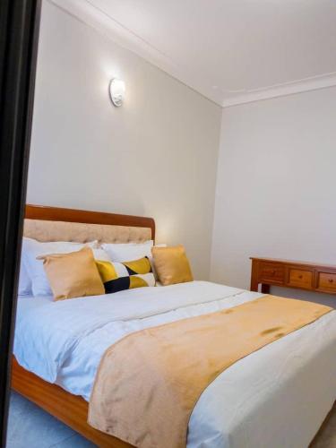 Llit o llits en una habitació de StaySpace Homes