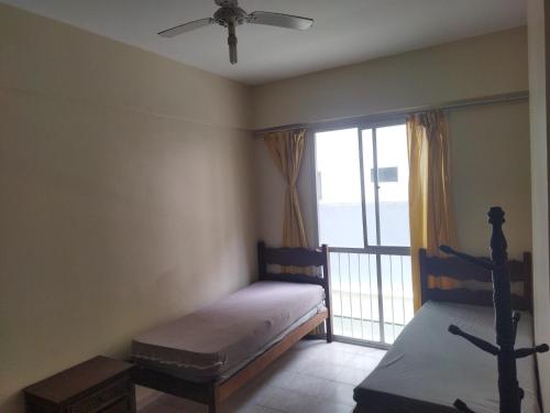 Postel nebo postele na pokoji v ubytování Centro, Praia e Avenida