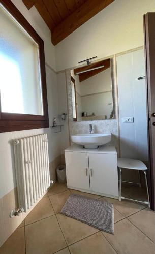 a bathroom with a sink and a mirror at Il Ghiandolino in Imola