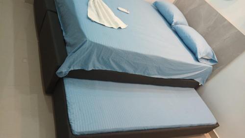 En eller flere senge i et værelse på Hermoso Apartamento Santa Marta