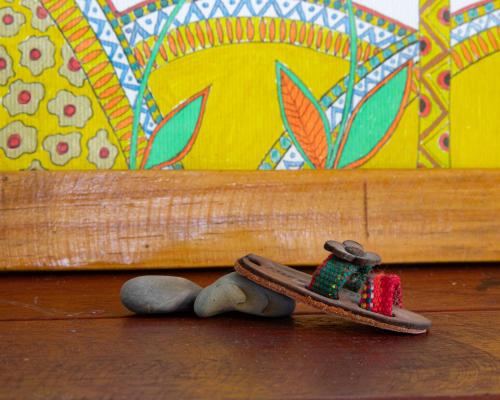 a pair of slippers and rocks sitting on a table at Casa Marimba in La Laguna