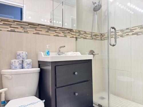 a bathroom with a toilet and a sink and a shower at ATL Downtown 2 Bedroom Condo Free Parking LM302 in Atlanta