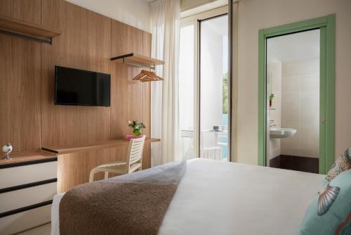 Cama o camas de una habitación en Hotel Calypso- Rimini Marina Centro