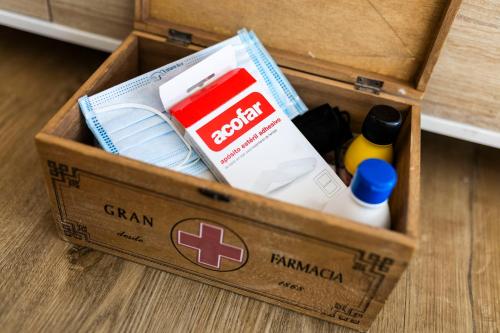 a wooden box with items in it on the floor at Covelodge - Piso a pocos metros de la playa in Pontevedra