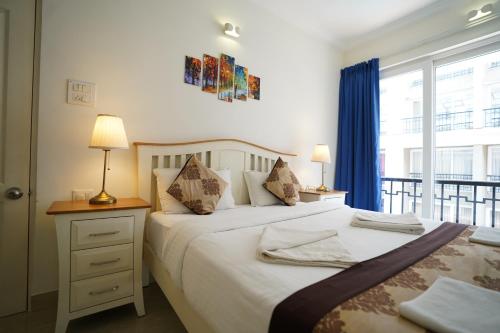 Katil atau katil-katil dalam bilik di Bellagio Rezidencia 1 BHK Service Apartments