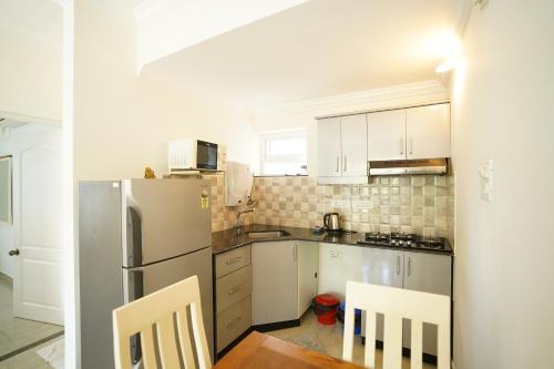 Dapur atau dapur kecil di Bellagio Rezidencia 1 BHK Service Apartments