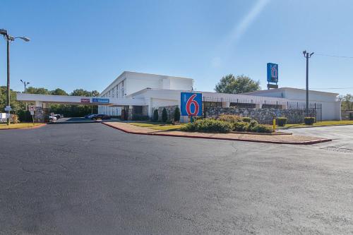 a gas station with a sign in front of it at Motel 6-Decatur, GA in Decatur