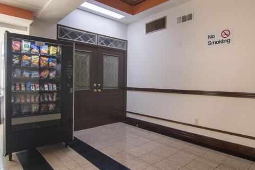 a no smoking room with a soda vending machine at Motel 6-Decatur, GA in Decatur