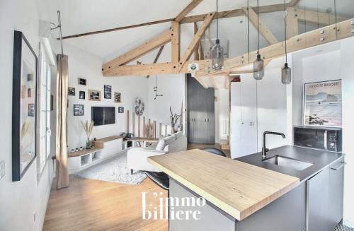 Kuchyňa alebo kuchynka v ubytovaní Appartement architecte proche plage