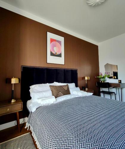 Ένα ή περισσότερα κρεβάτια σε δωμάτιο στο Apartament N7 Centrum