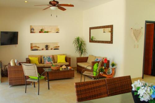 a living room with a couch and a table at Hidra luxurious accommodation in San Benito