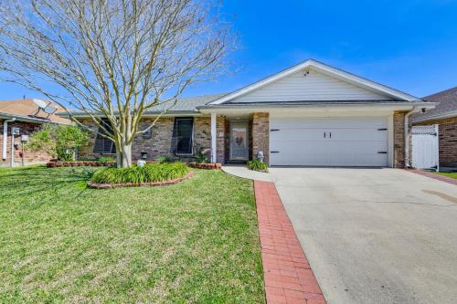 a house with a driveway and a garage at Boat Dock and Lift Waterfront Getaway in Slidell! in Slidell