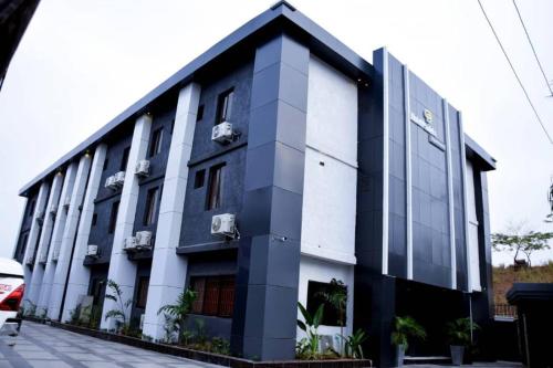 a black and white building with at Hotel Padelia International Airport Road Lagos in Ejigbo