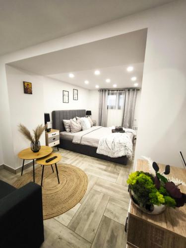 a bedroom with a bed and a table at Колеви хаус in Gabrovo