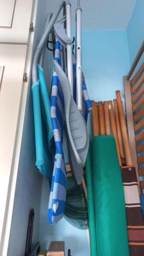 a group of utensils are hanging in a closet at Appartement vue mer in Koksijde