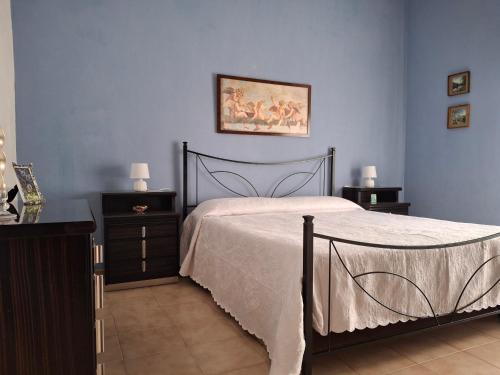 En eller flere senge i et værelse på Casa country