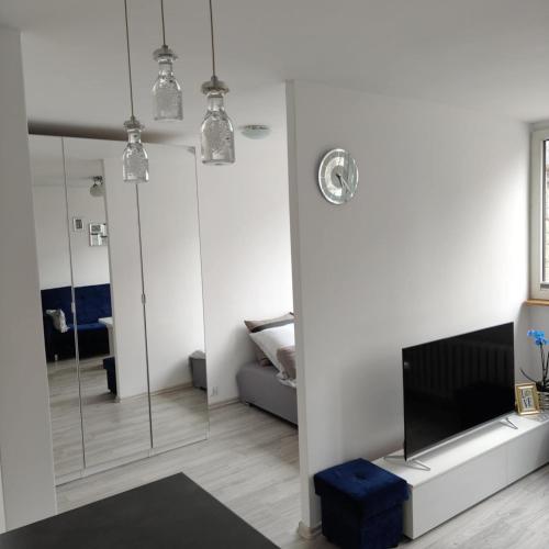 Ένα ή περισσότερα κρεβάτια σε δωμάτιο στο Mieszkanie Kłodzko Centrum