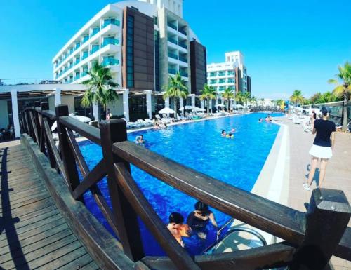 a group of people in a swimming pool at a resort at Linda Sunny Beach Hotel & Spa-Ultra All Inclusive in Side
